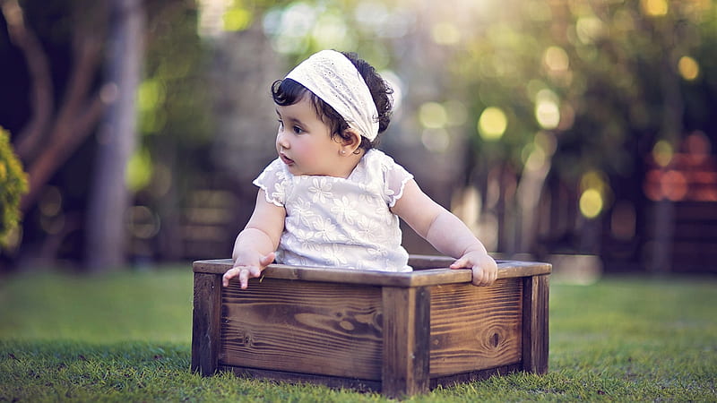 Cute Baby Girl Is Sitting Inside Wooden Box Wearing White Dress In Blur Bokeh Background Cute, HD wallpaper
