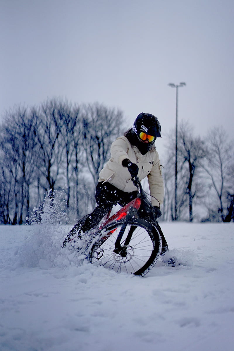 man in white jacket riding on black bmx bike on snow covered ground during daytime, HD phone wallpaper