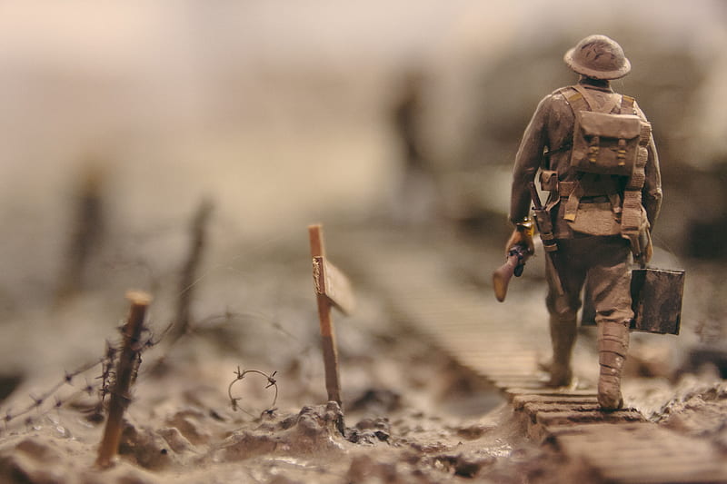 soldier walking on wooden pathway surrounded with barbwire selective focus graphy, HD wallpaper