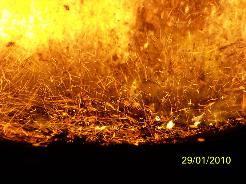 An employee takes as sample of liquid aluminum from a furnace at the...  News Photo - Getty Images