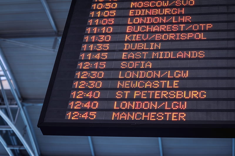 A low-angle shot of a departure board at an airport, HD wallpaper