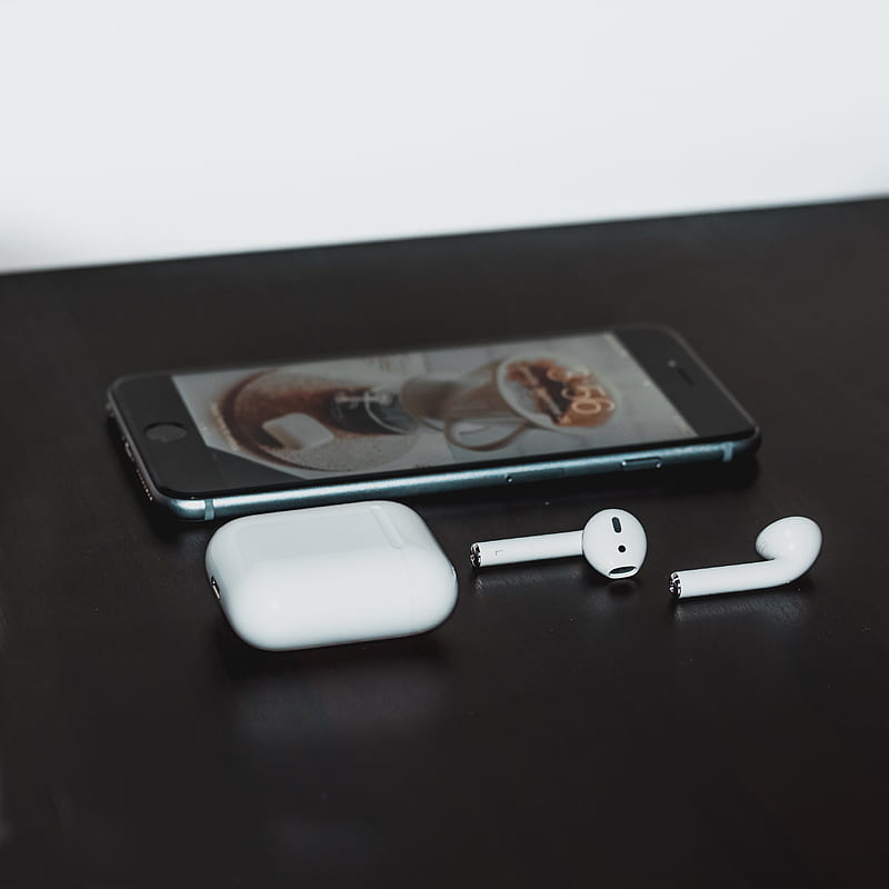 space gray iPhone 6 and Apple AirPods with case on black wooden table, HD phone wallpaper