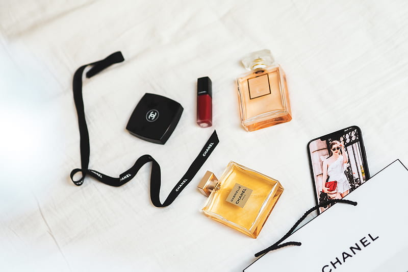 black framed eyeglasses beside brown and black perfume bottle, HD wallpaper