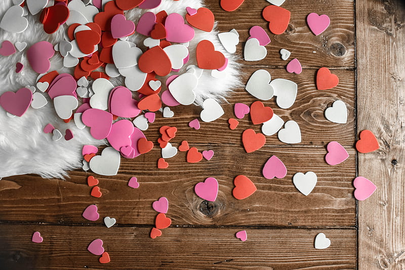 Top view of red white and pink heart shaped confetti of paper placed on wooden floor and white carpet, HD wallpaper