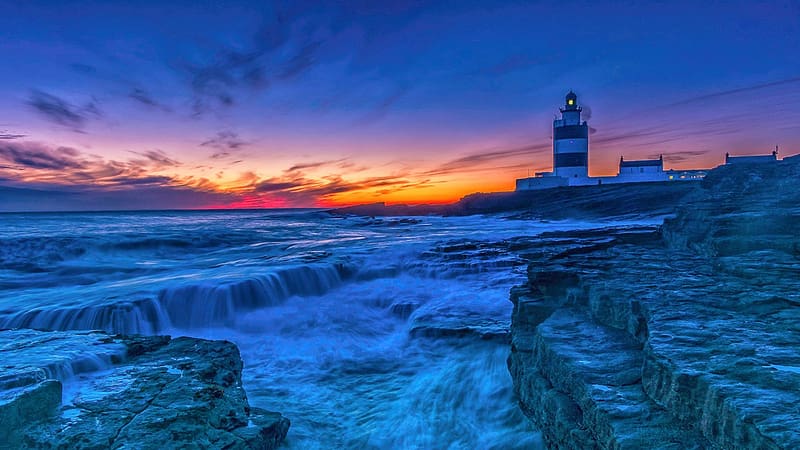 Hook Head Lighthouse at the Celtic Sea, Wexford, Ireland, rocks, coast, sea, clouds, colors, sky, sunset, HD wallpaper