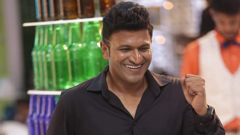 Handsome Smiley Puneeth Rajkumar Is Wearing Black Shirt Standing In Blur Bokeh Background Puneeth Rajkumar, HD wallpaper