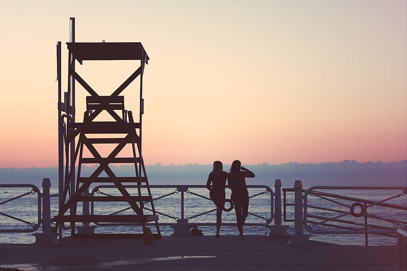 silhouette of two woman beside lifeguard tower, HD wallpaper