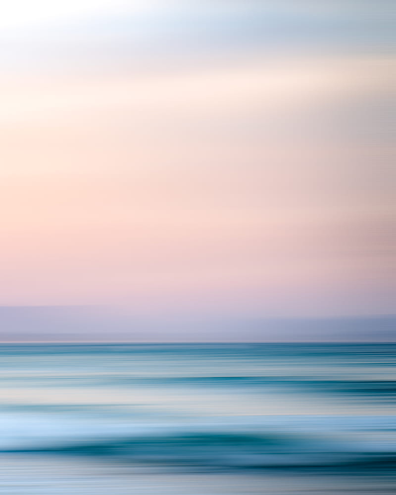 Magnificent view of ocean beneath light pink sky, HD phone wallpaper