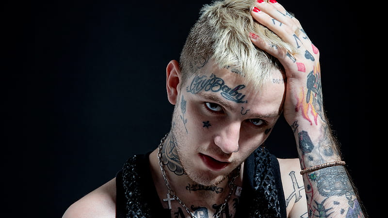 lil peep is wearing yellow dress and cap having tattoos on face and neck in  blur background hd music Wallpapers  HD Wallpapers  ID 42723