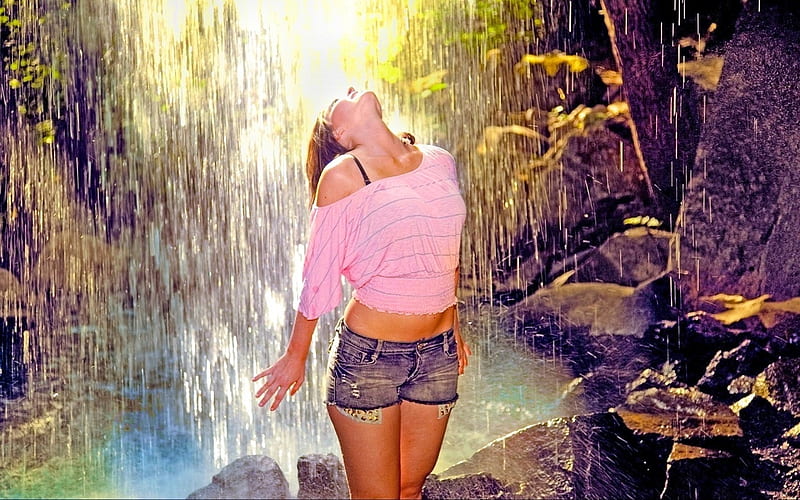Brunette enjoying the water, exposed right shoulder, pink t top, brunette, denim, rocks, water fall, head tilted back, shorts, black bra strap, HD wallpaper