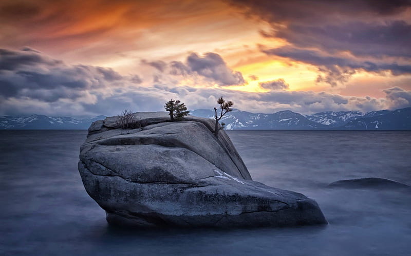 trees growing out of rock in a lake, rock, mountains, sunset, trees, clouds, lake, HD wallpaper