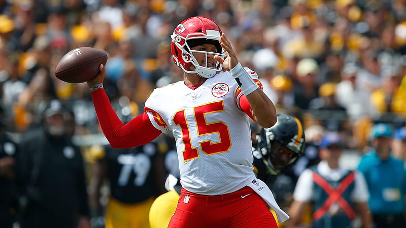 patrick mahomes is trying to throw a sprint football wearing red and white sports dress and helmet in blur audience background sports-, HD wallpaper