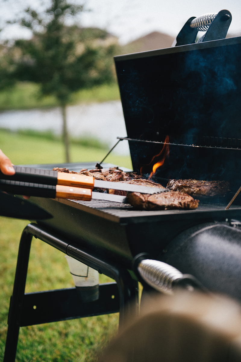 person grilling meat outdoors, HD phone wallpaper