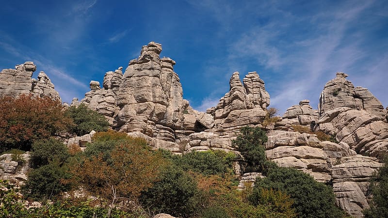 Layered rock towers in El Torcal de Antequera, Spain, sky, plants, rocks, bushes, landscape, clouds, HD wallpaper
