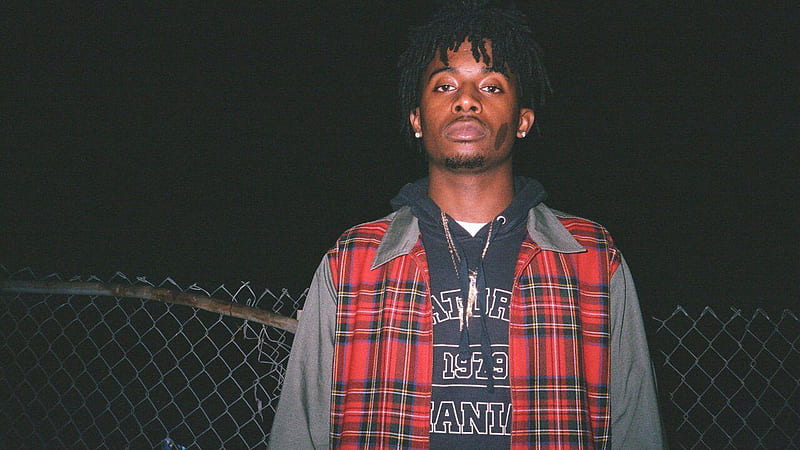 playboi carti is wearing red striped coat standing in fence black background wearing gold chains on neck music, HD wallpaper