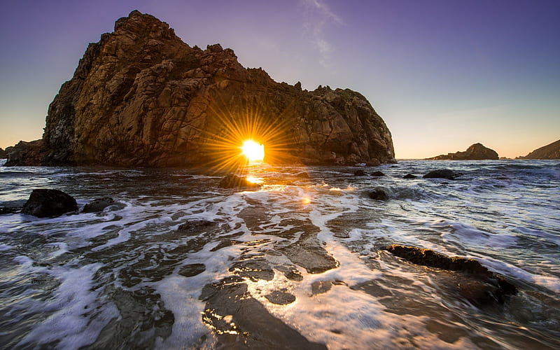 Sunrise peeking through some large stones on the beach at Monterey, California, california, coast, beaches, peaceful, rocks, rock, beach, sunrise, coastal, serf, sky, monterey, sun, HD wallpaper