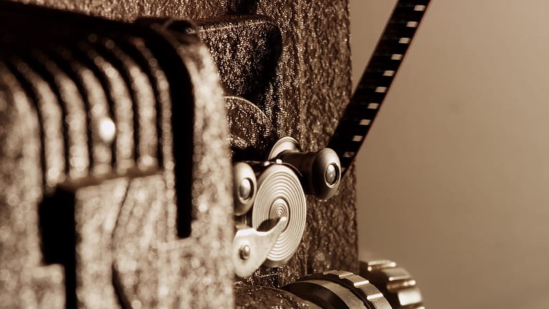 Extreme close up of 8mm movie projector and detail of the sprocket mechanism with film and rollers in action in 1616308 Stock Video at Vecteezy, HD wallpaper