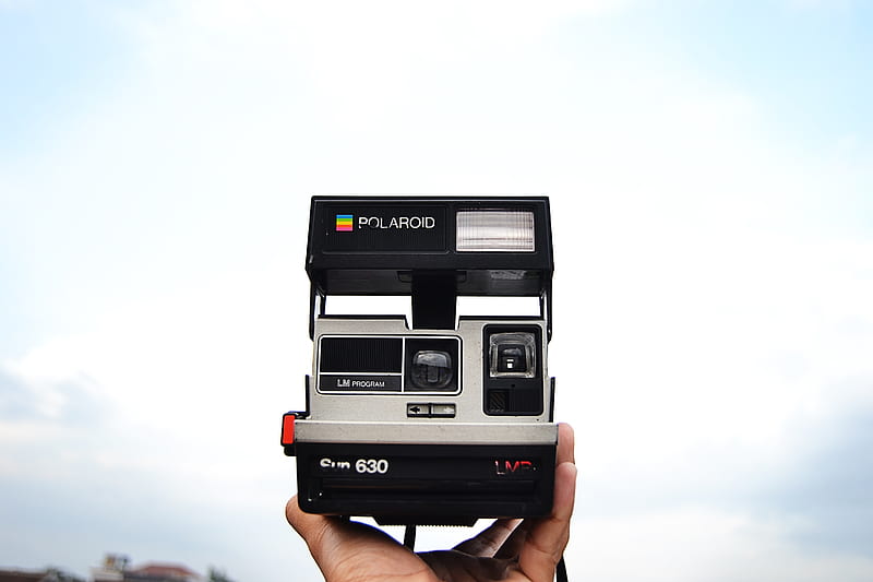 person holding black and gray Polaroid 630 instant camera, HD wallpaper