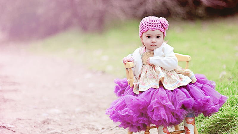 cute baby girl is sitting on chair in blur background wearing purple dress and woolen knit cap cute, HD wallpaper