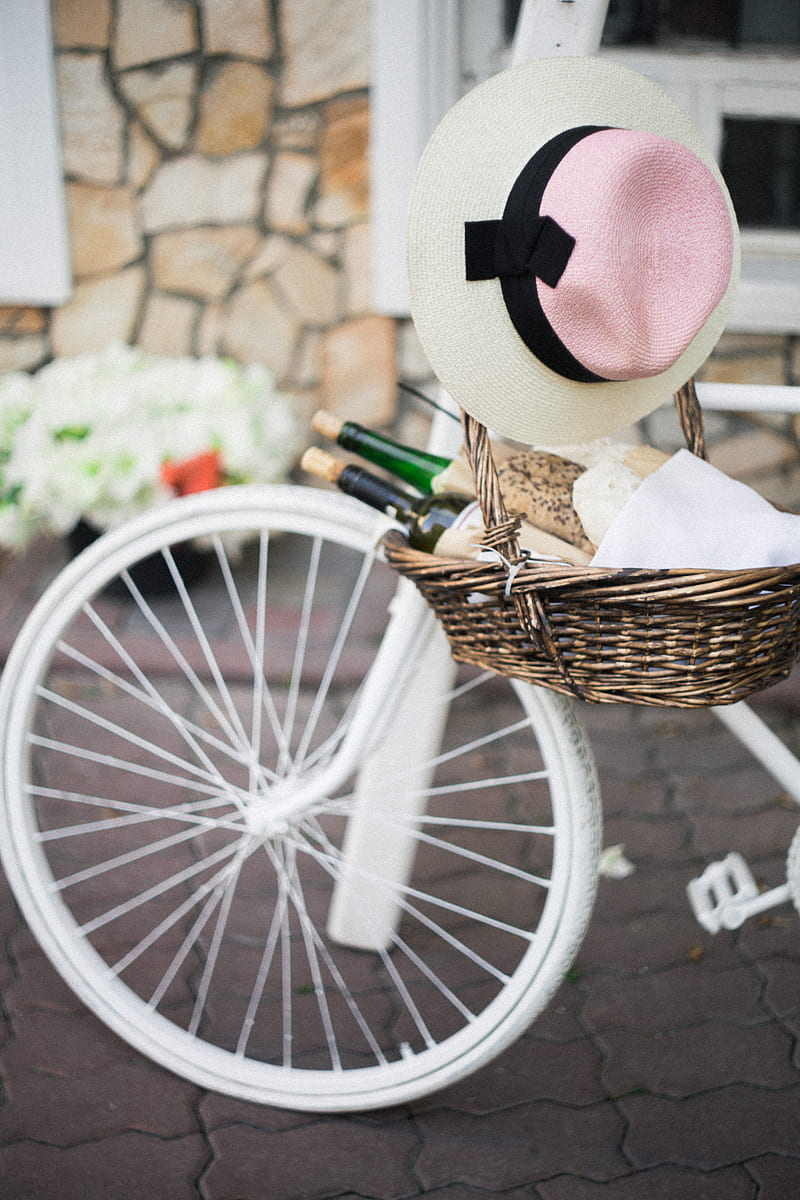 brown wicker basket with white, pink, and black sunhat besides white bike, HD phone wallpaper