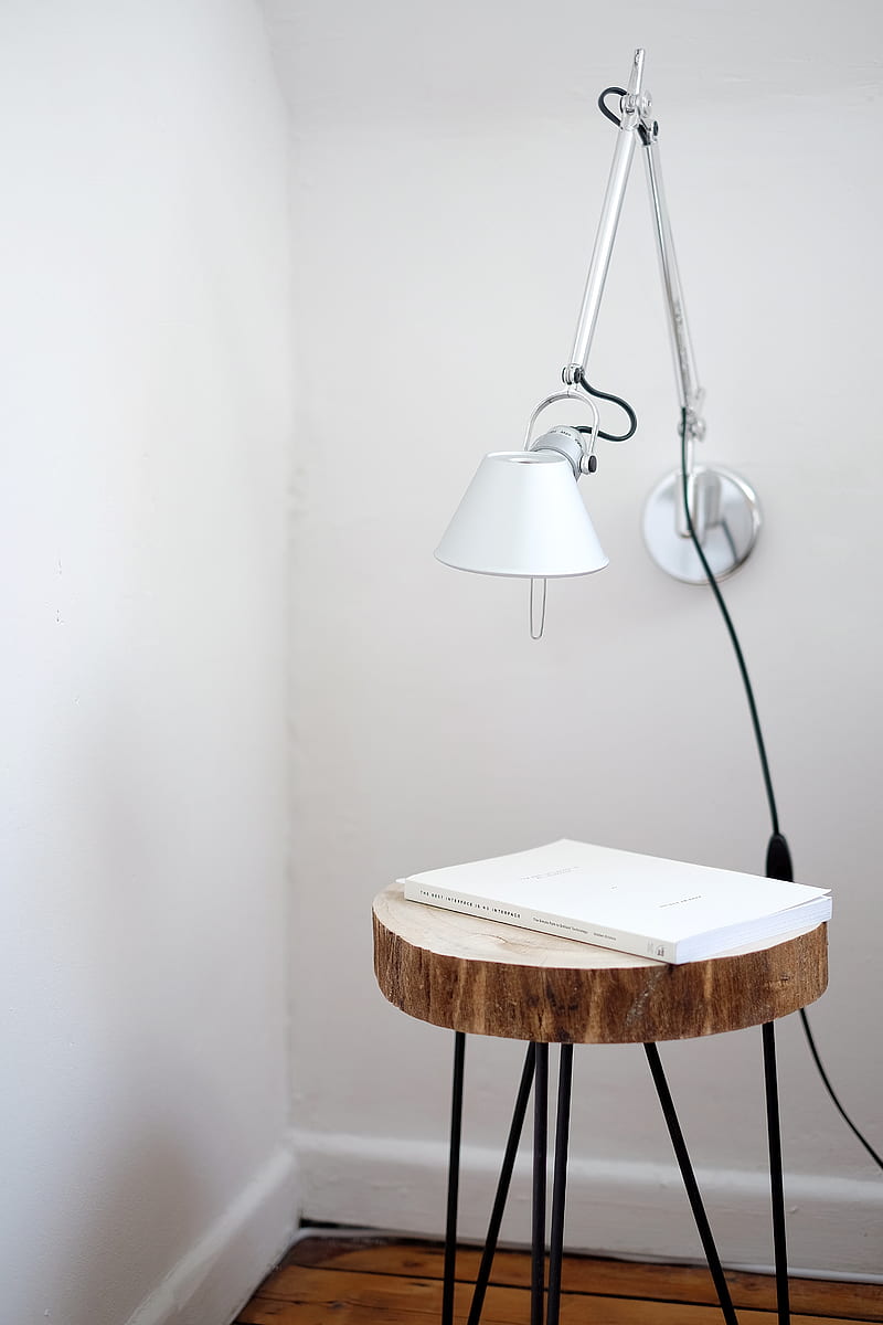 gray desk lamp mount on white wall under brown stool with white book on top near wall corner, HD phone wallpaper