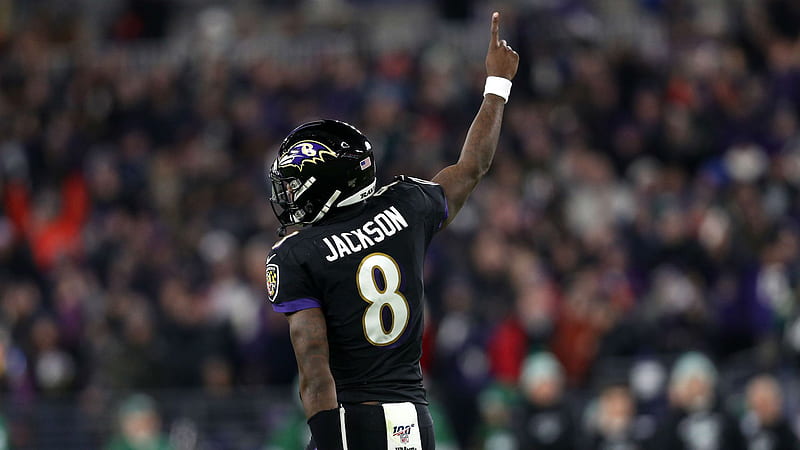 Lamar Jackson Is Wearing Black Dress And Helmet Having One Hand In The Air With Audience Background Sports, HD wallpaper