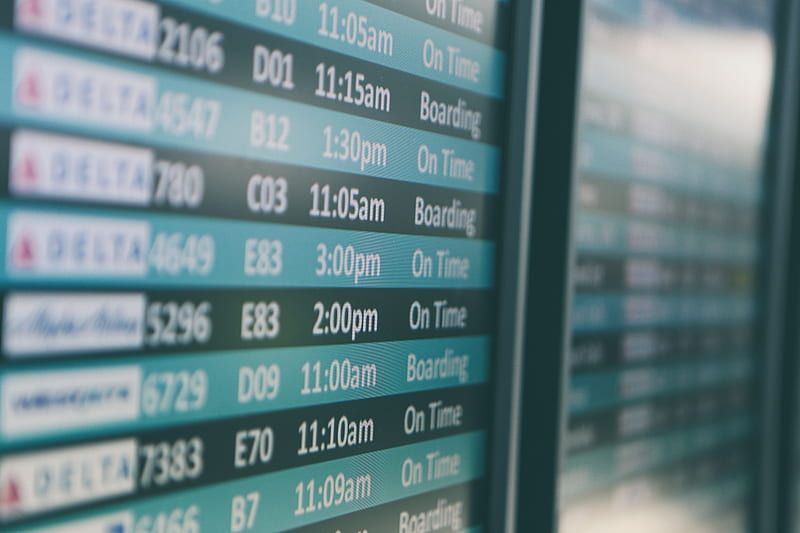 Airport departures timetable showing Delta and Alaska Airlines flights on time and boarding, HD wallpaper