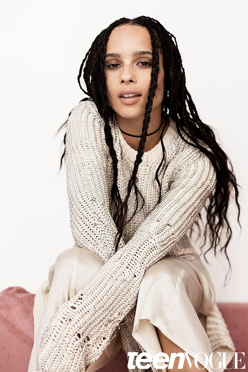 Zoë Kravitz, women, actress, model, looking at viewer, simple background, sitting, Teen Vogue, ebony, freckles, long hair, brunette, braided hair, celebrity, nose ring, white sweater, HD phone wallpaper