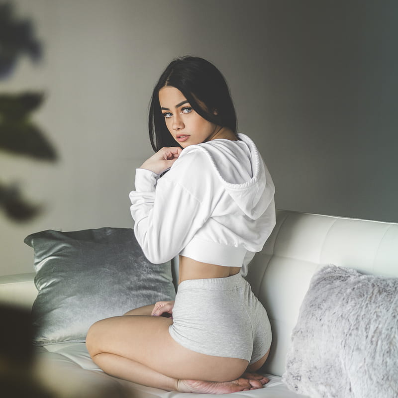 woman wearing white pullover hoodie and grey boyshorts on sofa, HD phone wallpaper