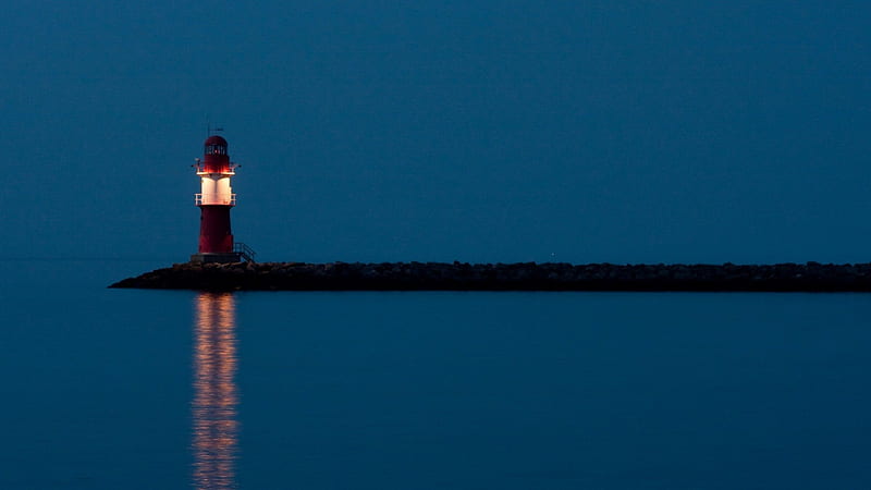 fantastic lighthouse lit at night, rocks, pier, lighthouse, night, light, HD wallpaper