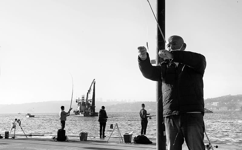 man in black jacket holding fishing rod, HD wallpaper