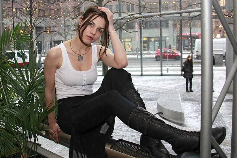 Ana Ularu, black tights, brunette, white tank top, lace up high boots, pendant, black skirt, sitting, tree lights, plants, HD wallpaper