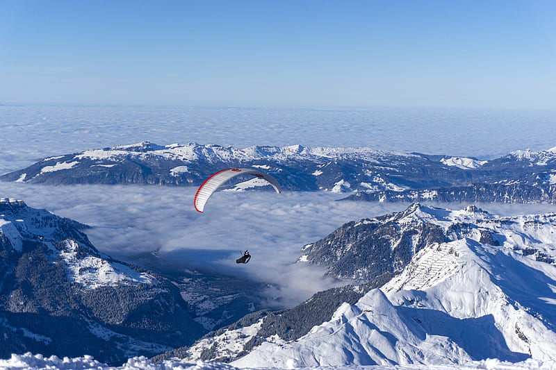 person riding on parachute over snow covered mountain during daytime, HD wallpaper