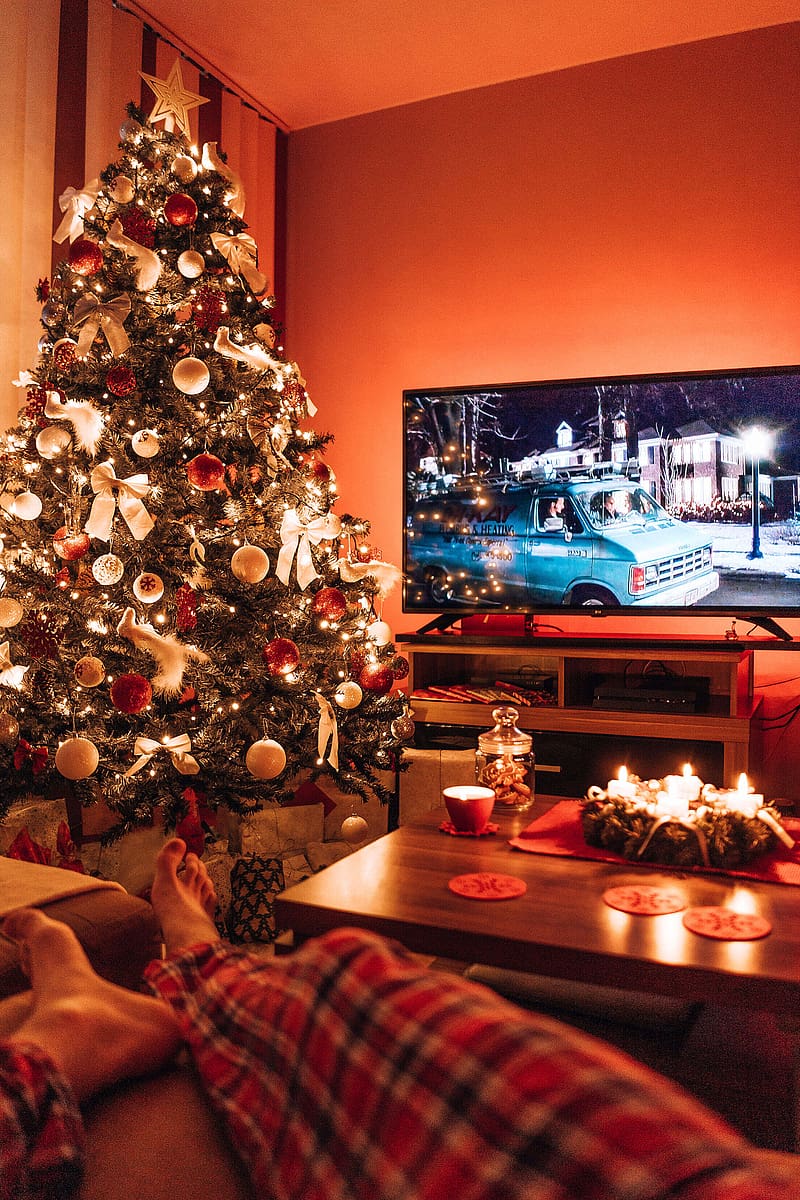 Man Relaxing in a Living Room and Watching a Christmas Movie in the Evening Stock, HD phone wallpaper