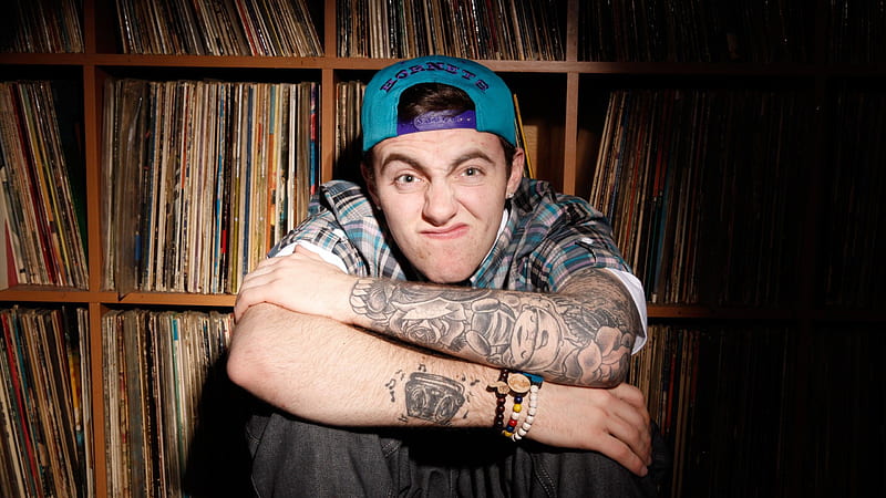 Mac Miller Is Sitting And Leaning Back on Bookshelf Celebrities, HD wallpaper