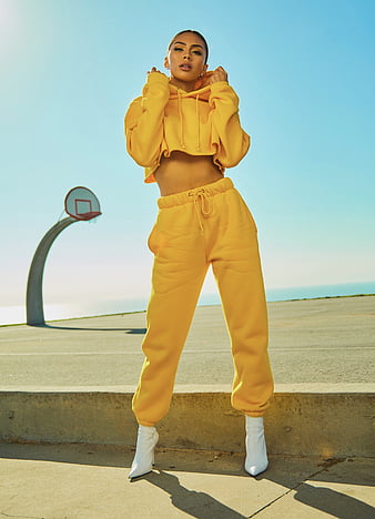 Little kids, boy and girl, in sunglasses and hoods, colorful tracksuits,  sneakers. They posing isolated on white studio background Stock Photo |  Adobe Stock