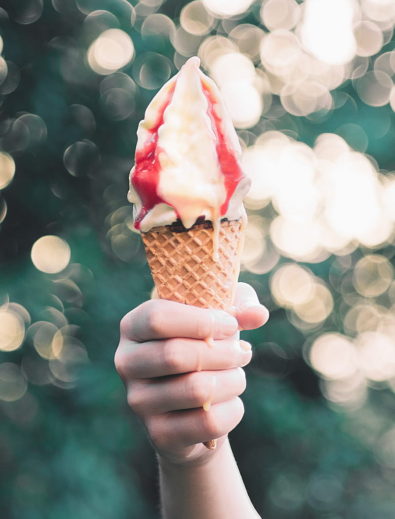 person holding brown ice cream cone with strawberry flavored ice cream, HD phone wallpaper