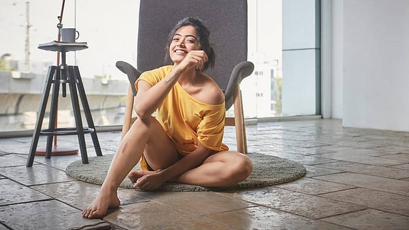 Smiley Rashmika Mandanna Is Wearing Yellow Dress Sitting On Floor In Chair Background Girls, HD wallpaper