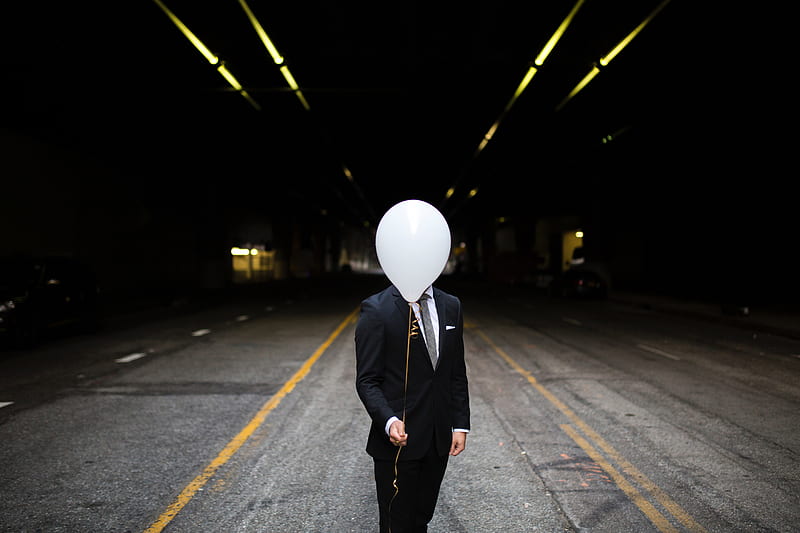 Young Man In Suit Holding Balloons In Front Of Face, man, graphy, balloons, boy, HD wallpaper