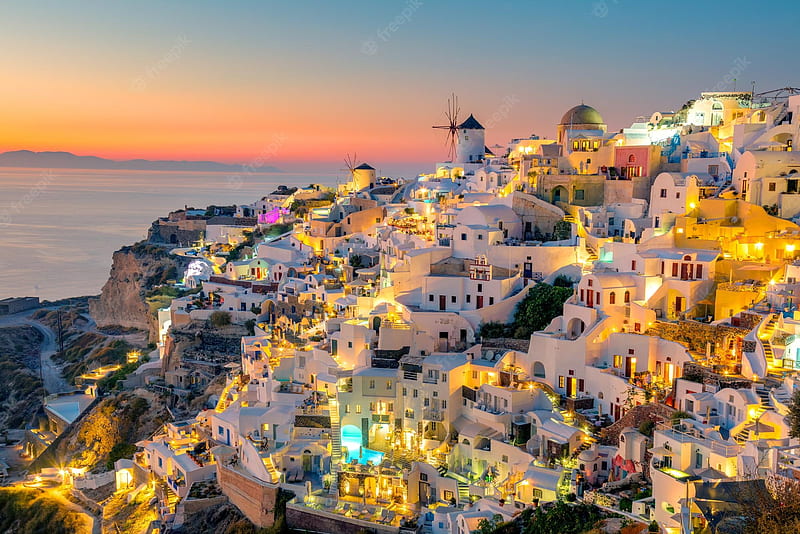 Premium . Sunset night view of traditional greek village oia on santorini island in greece santorini is iconic travel destination in greece famous of its sunsets and traditional white architecture, HD wallpaper