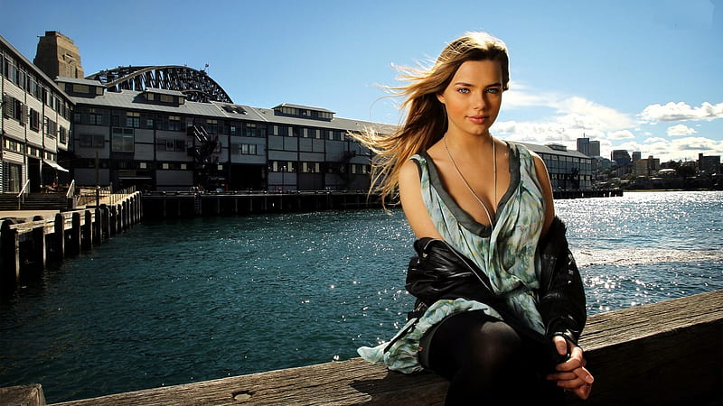 Indiana Evans, pale blue dress, brunette, black leather jacket, black tights, sitting by a warf, jewelry, HD wallpaper