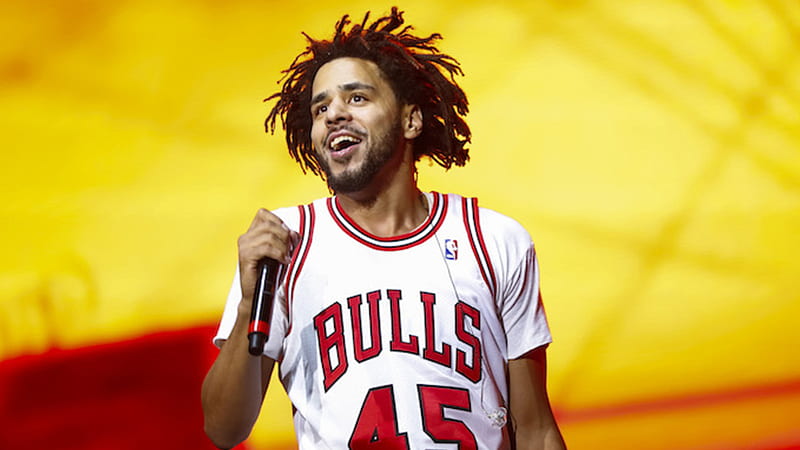 J Cole Is Wearing White Bulls T-Shirt Standing In Yellow Red Background J Cole, HD wallpaper