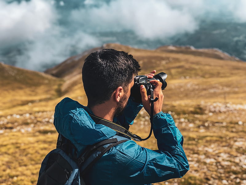 Man in blue jacket taking of mountain, HD wallpaper | Peakpx