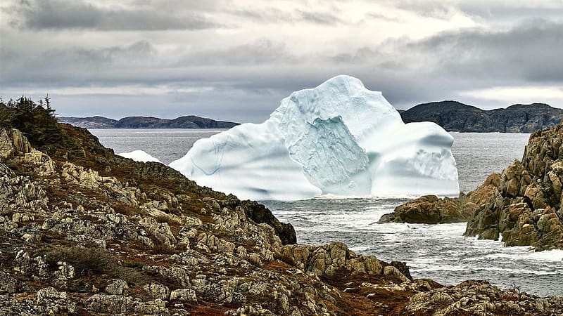 A 15,000 year old iceberg floats by in Newfoundland, canada, sea, island, clouds, sky, stones, ice, HD wallpaper