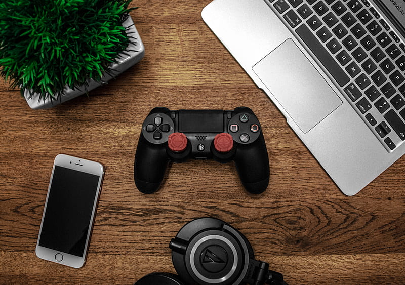 Silver Macbook Beside Black Sony Ps4 Dualshock 4, Silver Iphone 6, and Round Black Keychain on Brown Wooden Table, HD wallpaper