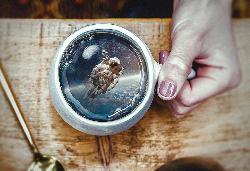 Special cup of coffee, aneth charles, cosmonaut, fantasy, coffee, astronaut, hand, cup, creative, HD wallpaper