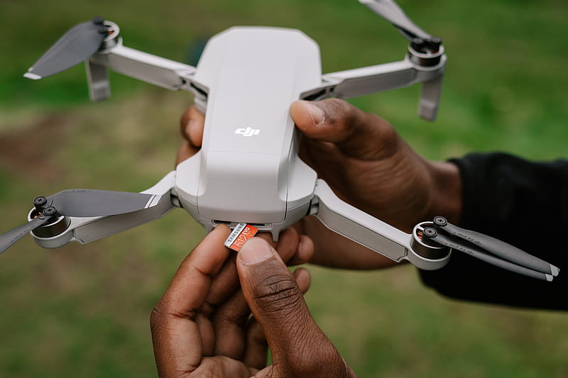person holding white quadcopter drone, HD wallpaper