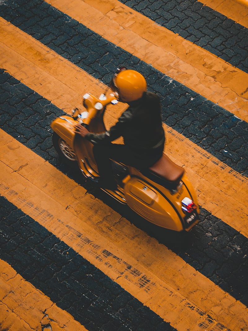 man riding on yellow motor scooter on striped yellow lines, HD phone wallpaper