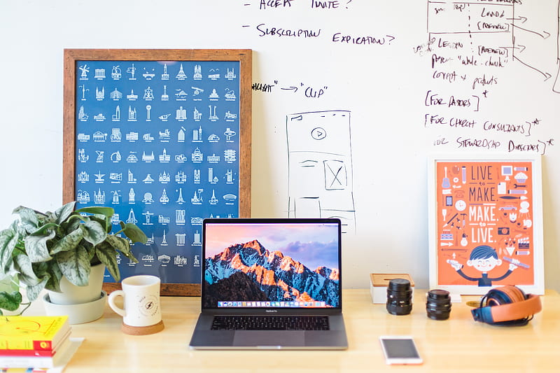 MacBook Pro on brown wooden table beside white mug, HD wallpaper