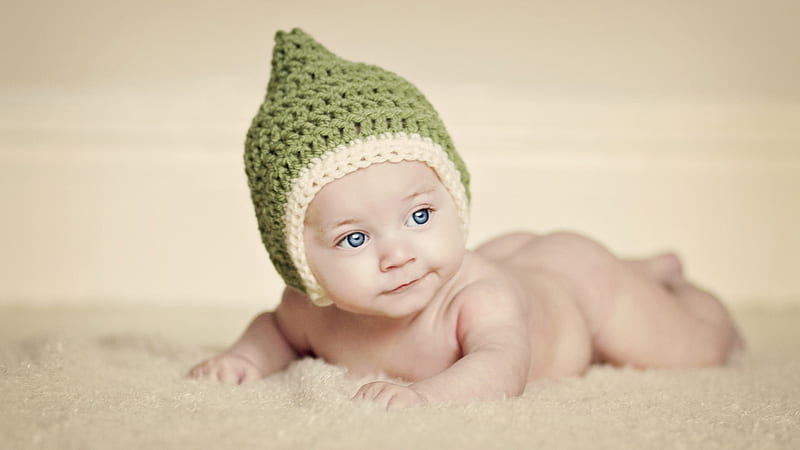 Grey Eyes Cute Baby Is Lying Down On Towel Wearing Green Sandal Woolen Knitted Cap Cute, HD wallpaper